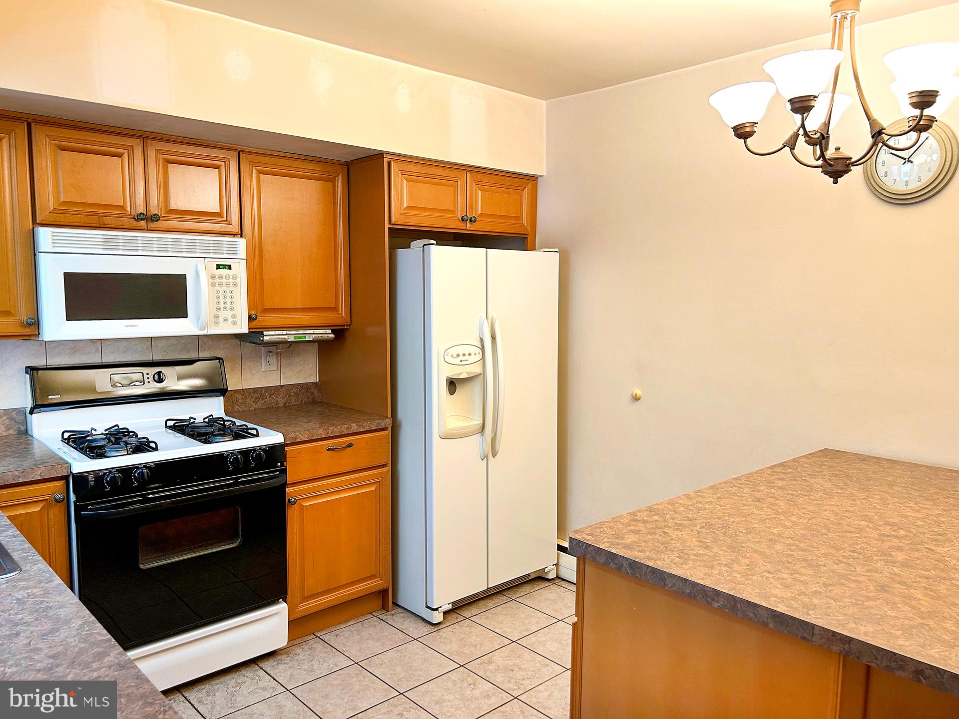 2125 Lott Avenue Philadelphia, PA 19115 - Photo 12 of 21 Modern kitchen with warm wood tones.