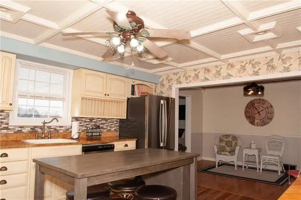 a kitchen with stainless steel appliances granite countertop a stove and refrigerator