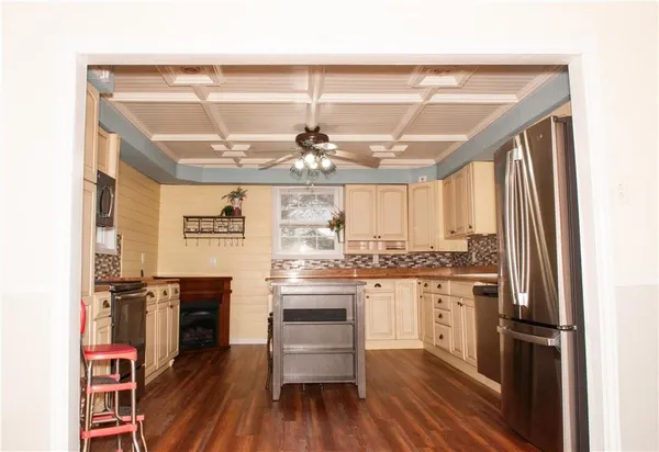 a view of a kitchen from a dining room