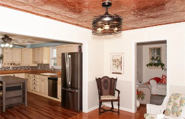 a view of a dining room with furniture and wooden floor