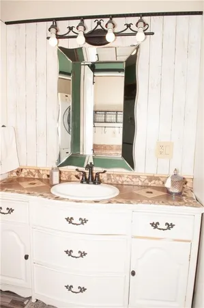 a bathroom with a glass door shower