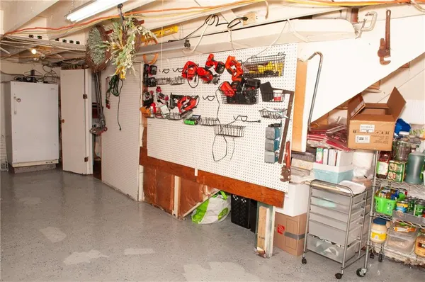a view of room with wooden floor