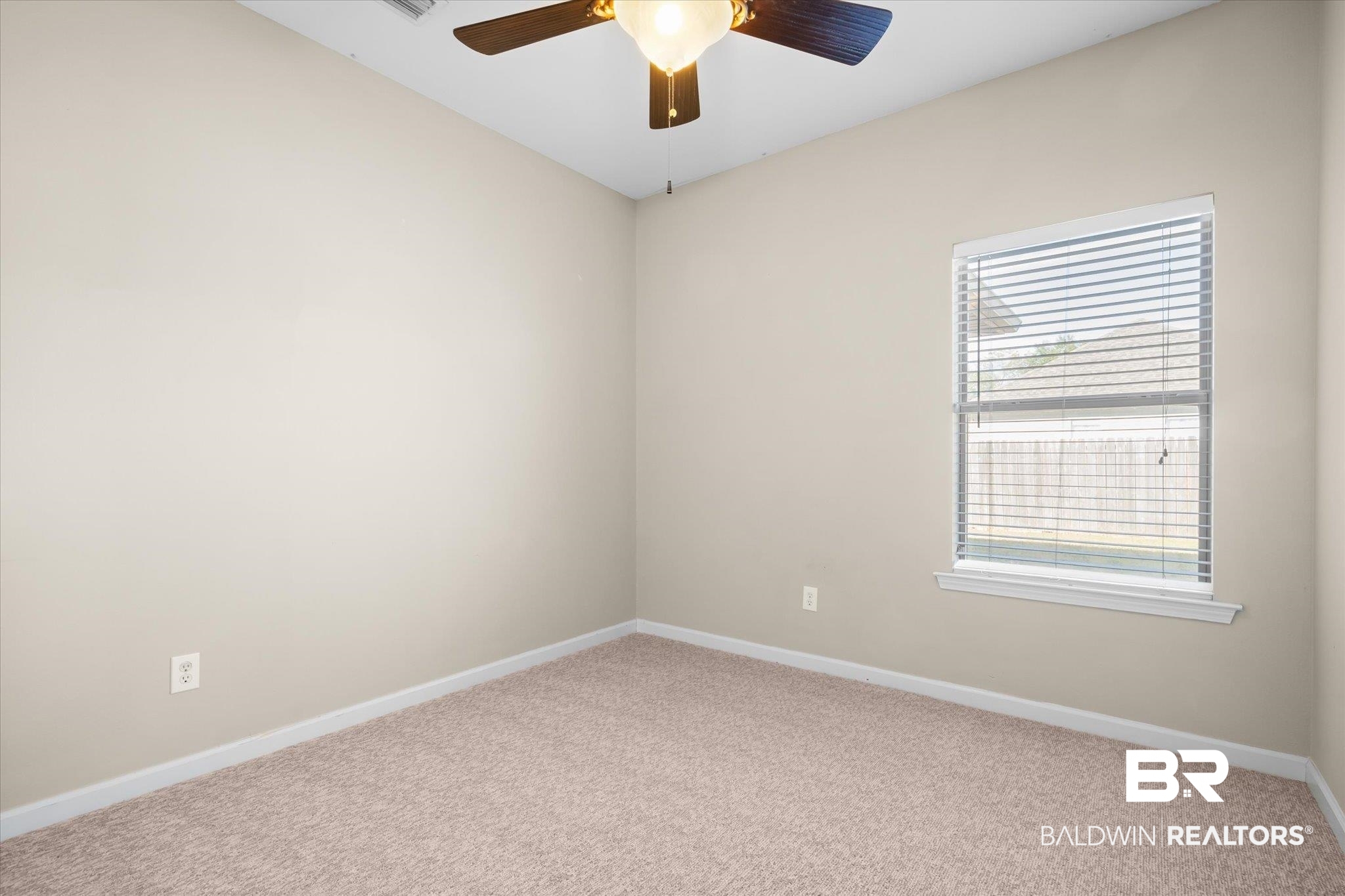 10251 Fionn Loop Daphne, AL 36526 - Photo 17 of 28 Unfurnished room with carpet and ceiling fan