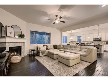 a kitchen with a dining table chairs sink and cabinets