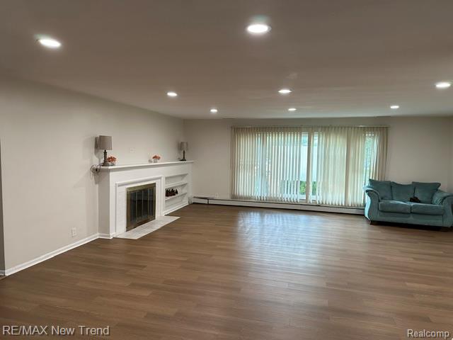 4510 West Maple Road Bloomfield Hills, MI 48301 - Photo 4 of 13 Spacious room featuring wood-finish flooring and recessed lighting