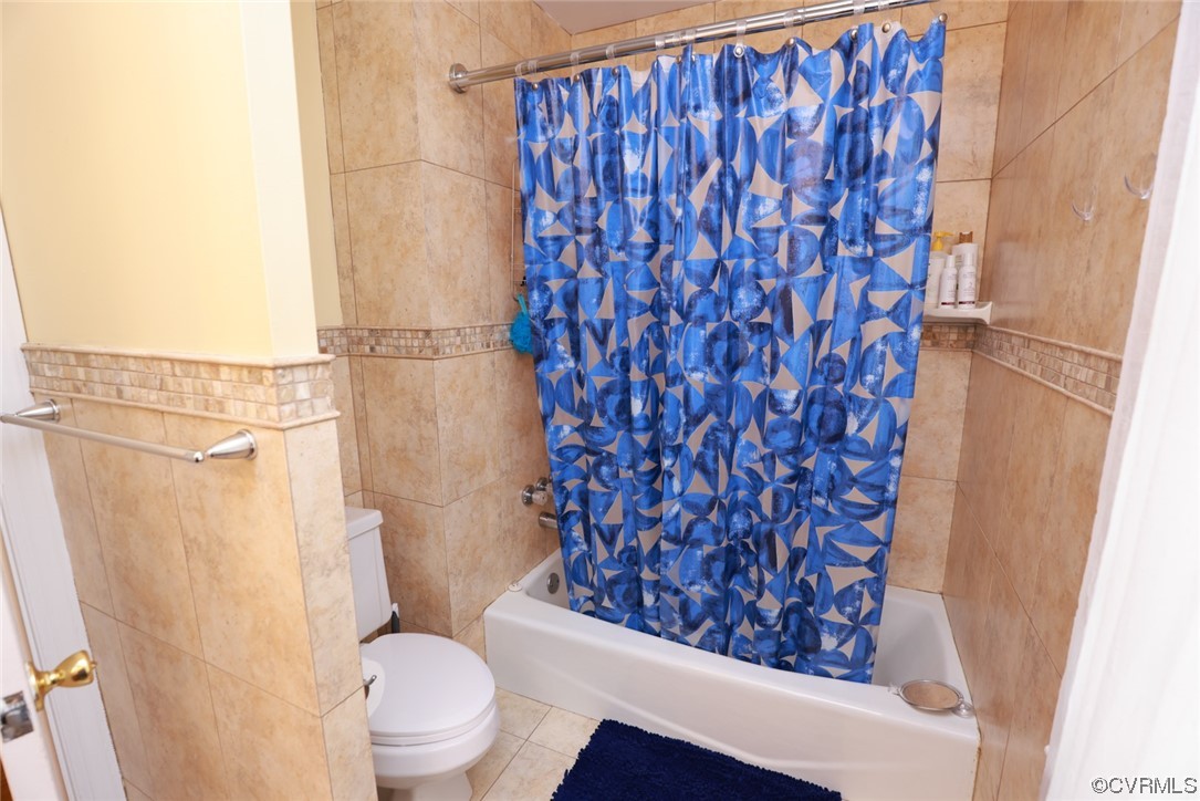 2000 Camborne Road Chesterfield, VA 23236 - Photo 25 of 44 Bathroom featuring tile floors, toilet, shower curtain, and shower / tub combination