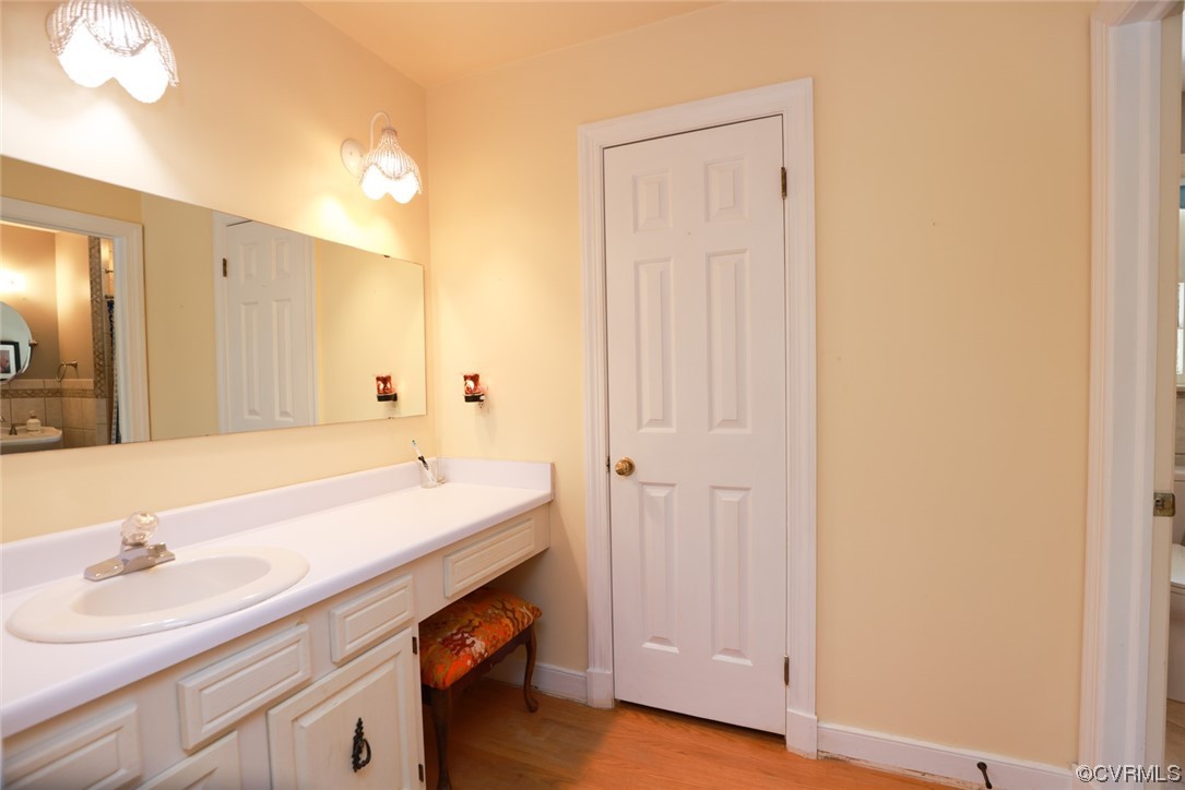 2000 Camborne Road Chesterfield, VA 23236 - Photo 32 of 44 Bathroom with hardwood floors, mirror, and vanity