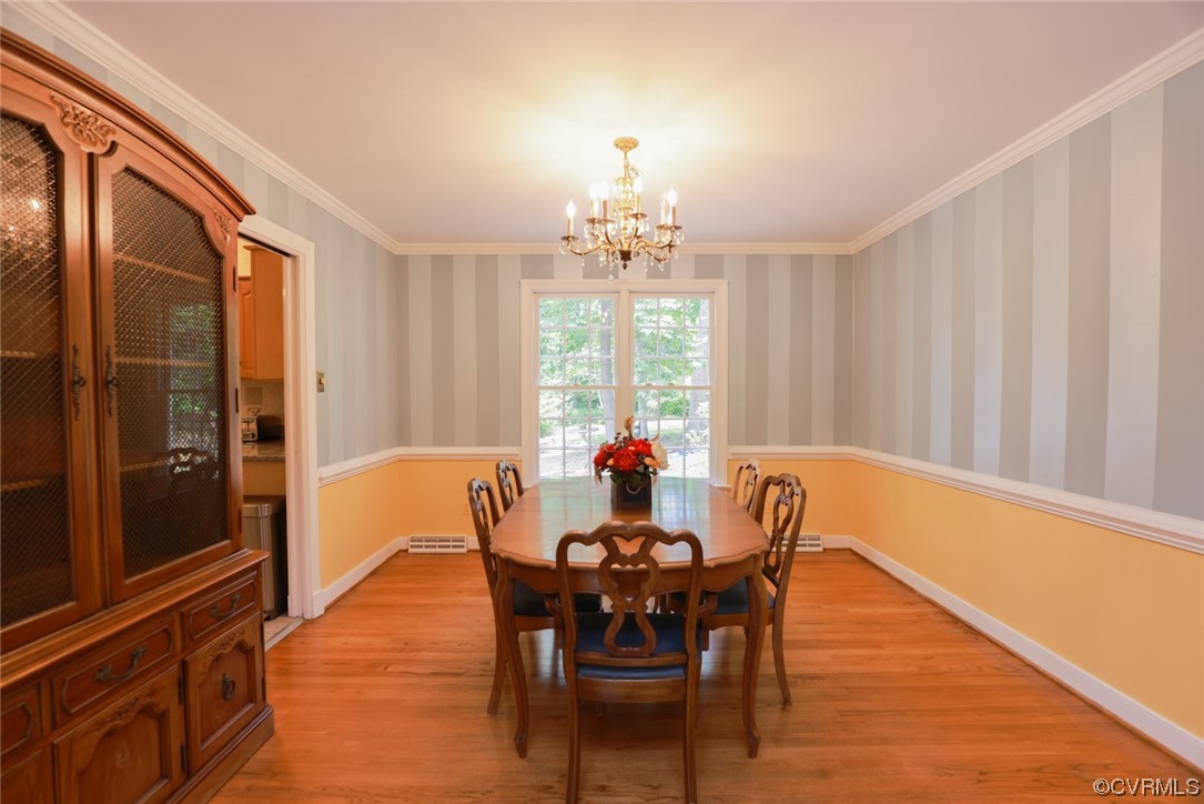 2000 Camborne Road Chesterfield, VA 23236 - Photo 6 of 44 Dining area with a notable chandelier, wood-type flooring, and natural light