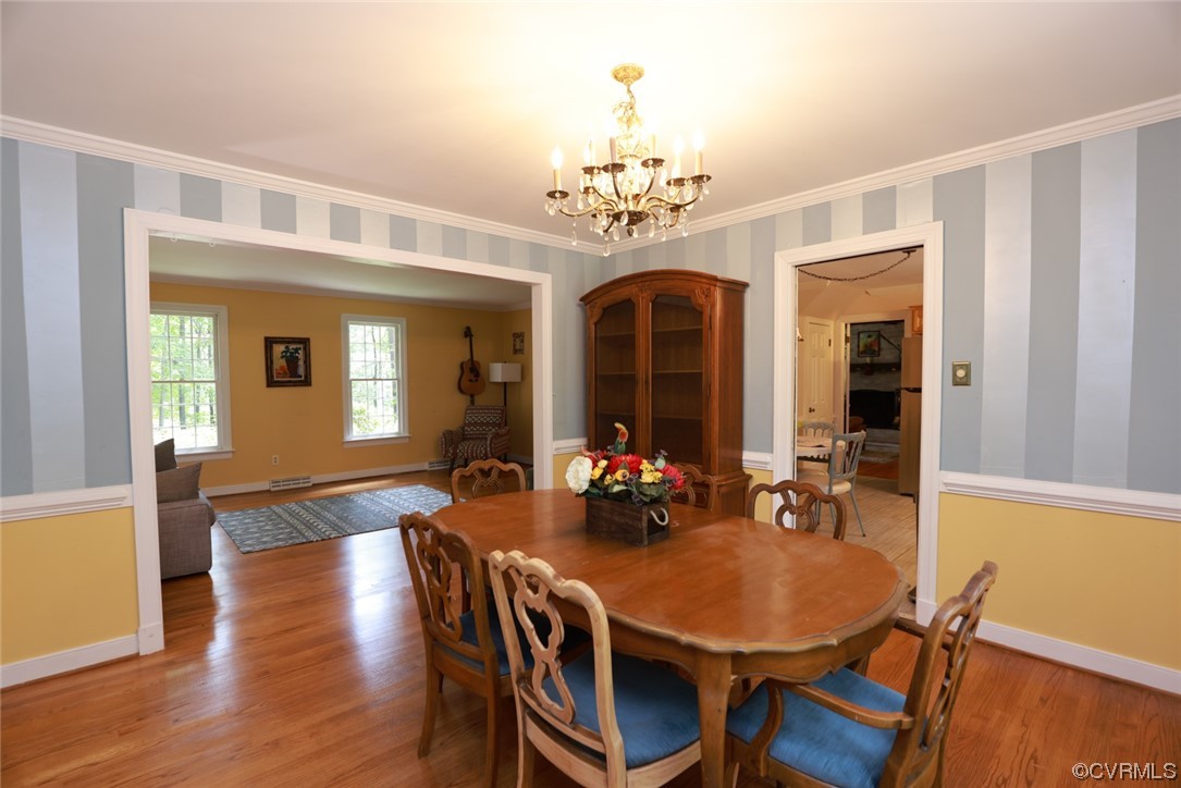 2000 Camborne Road Chesterfield, VA 23236 - Photo 7 of 44 Dining area with a notable chandelier and hardwood flooring