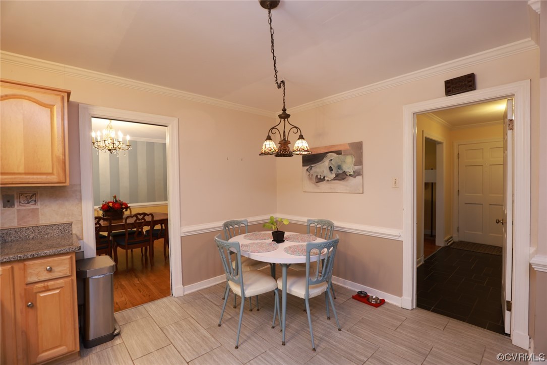 2000 Camborne Road Chesterfield, VA 23236 - Photo 9 of 44 Tiled dining area featuring a notable chandelier