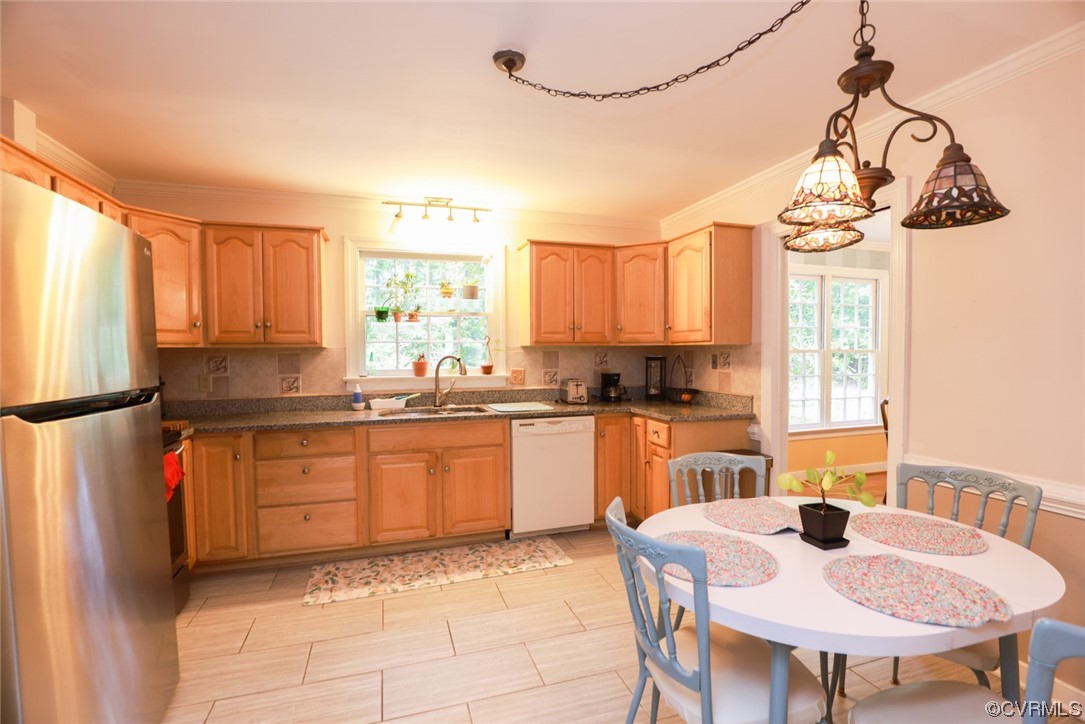 2000 Camborne Road Chesterfield, VA 23236 - Photo 10 of 44 Kitchen with a wealth of natural light, dishwasher, refrigerator, light tile flooring, dark countertops, and brown cabinets