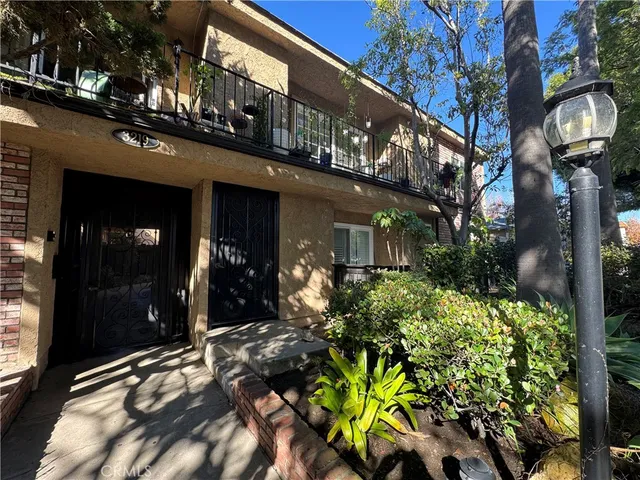a view of empty room with a fireplace and potted plants