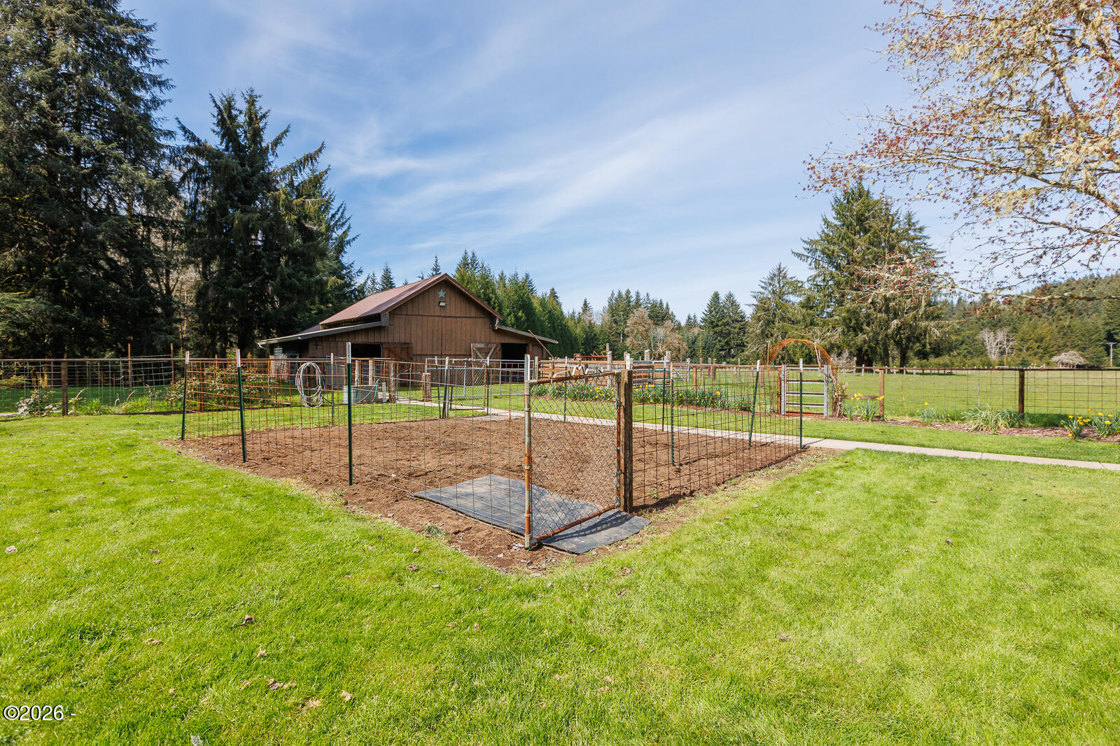 871 Old River Road Northeast Siletz, OR 97380 - Photo 60 of 86 Fenced Garden and Barn