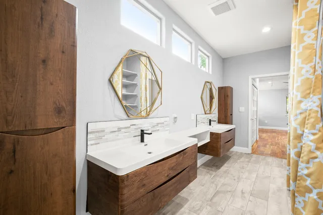a bathroom with a sink and a mirror