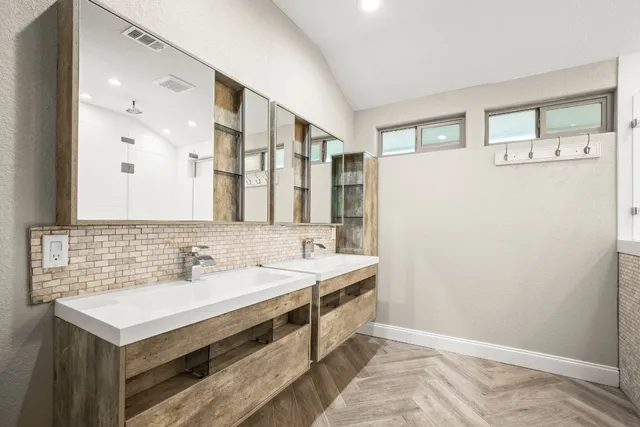 a bathroom with a sink and a mirror