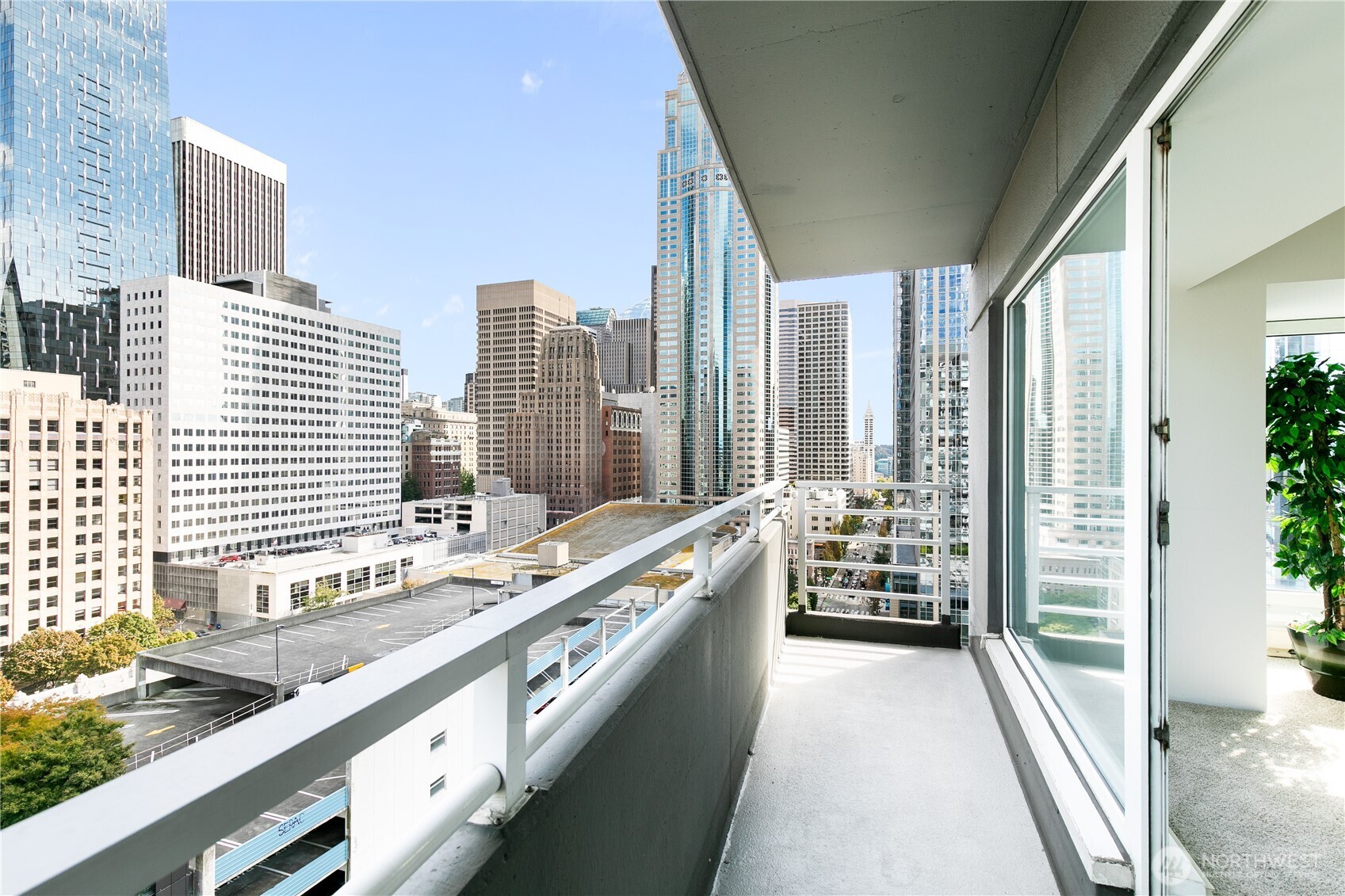 1415 2nd Avenue, Unit 1607 Seattle, WA 98101 - Photo 1 of 40 a large white kitchen with a large window