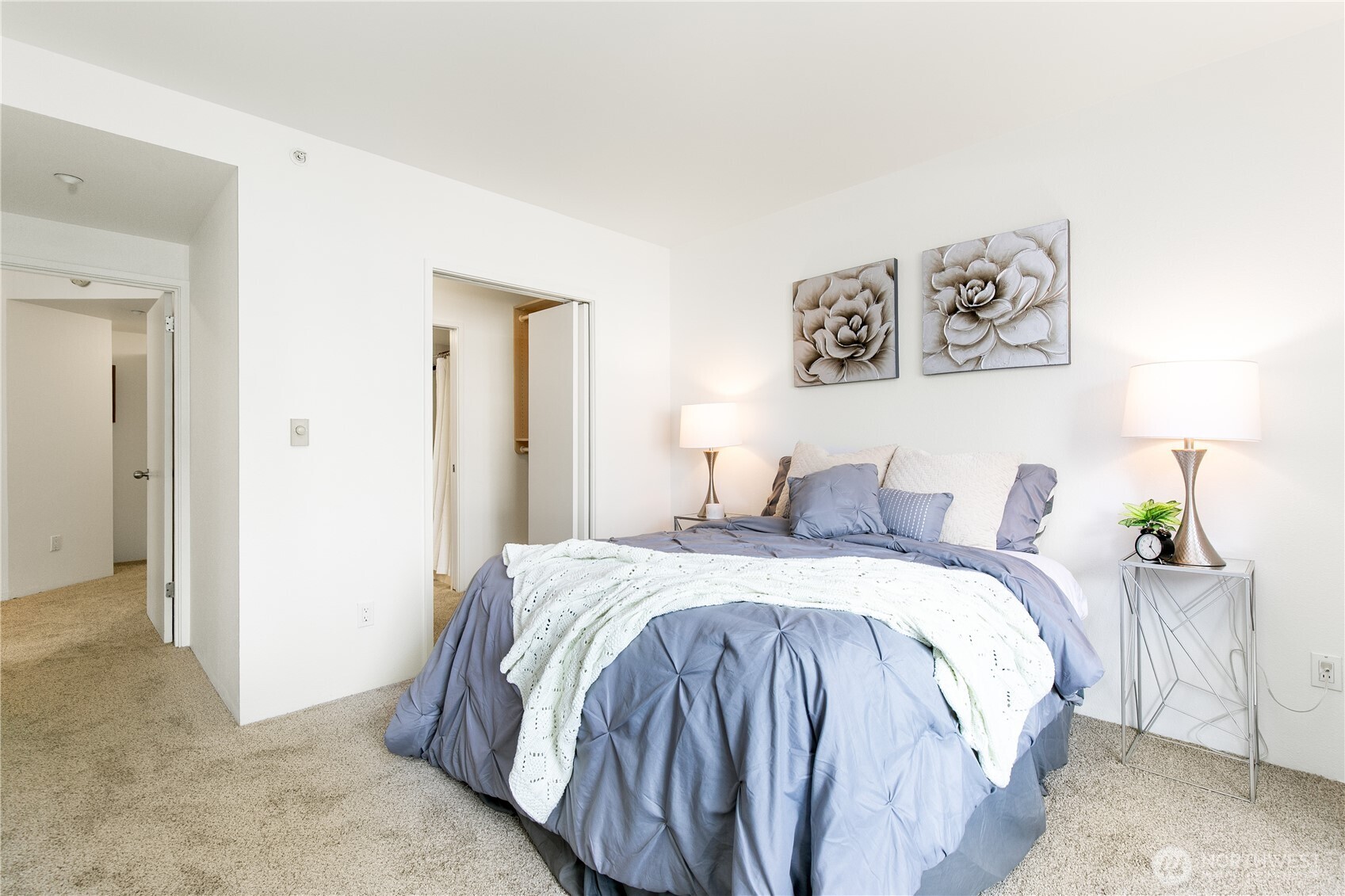 1415 2nd Avenue, Unit 1607 Seattle, WA 98101 - Photo 17 of 40 a bedroom with a bed and a table