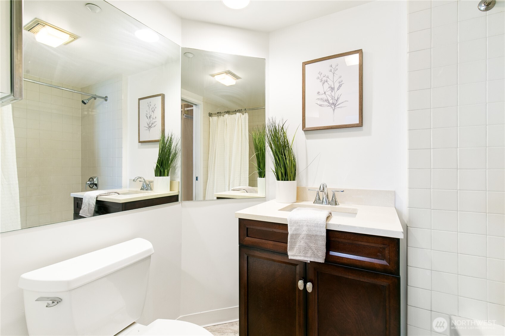1415 2nd Avenue, Unit 1607 Seattle, WA 98101 - Photo 19 of 40 a bathroom with a sink and a mirror