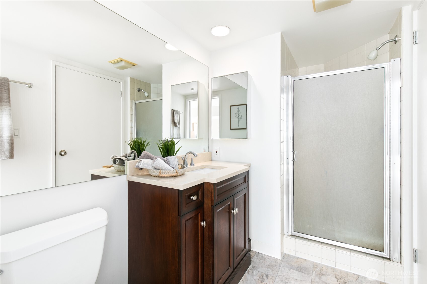 1415 2nd Avenue, Unit 1607 Seattle, WA 98101 - Photo 23 of 40 a bathroom with a sink a toilet and shower