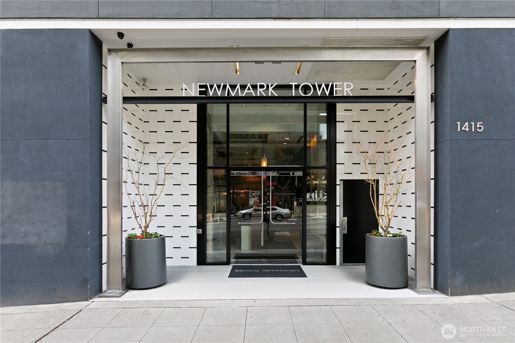 1415 2nd Avenue, Unit 1607 Seattle, WA 98101 - Photo 24 of 40 a kitchen with a wooden door
