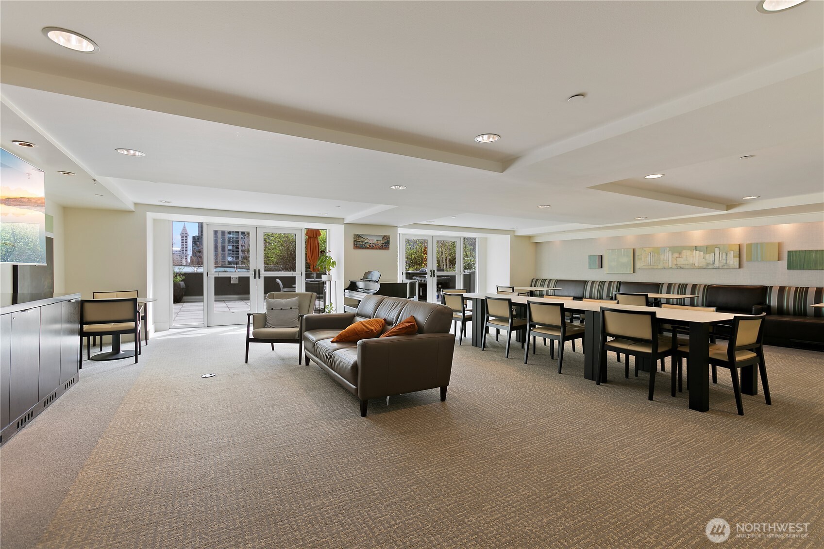 1415 2nd Avenue, Unit 1607 Seattle, WA 98101 - Photo 26 of 40 a living room with furniture and a flat screen tv