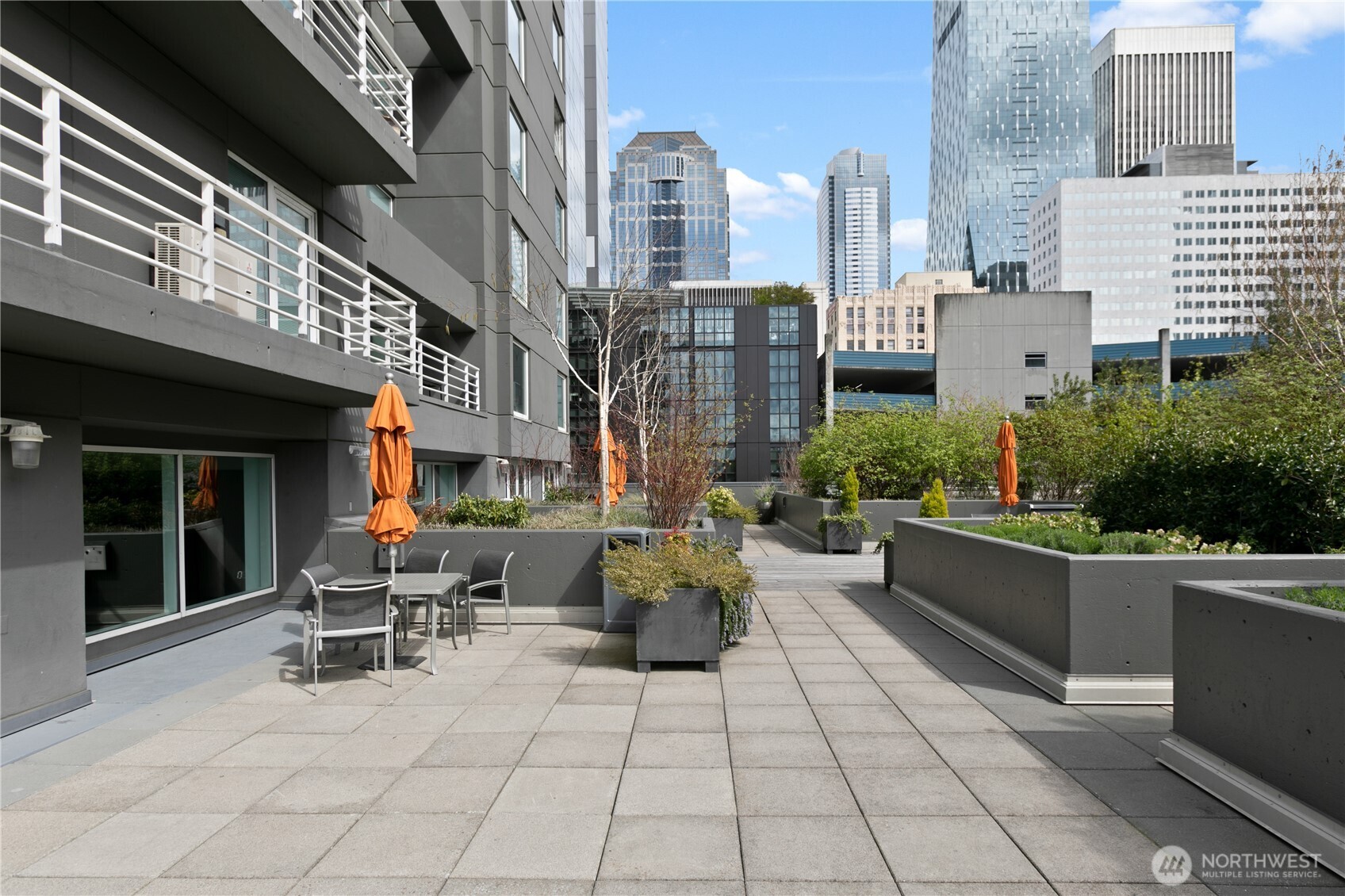 1415 2nd Avenue, Unit 1607 Seattle, WA 98101 - Photo 31 of 40 a building outdoor space with lots of tables and chairs