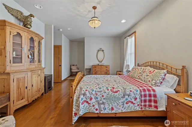 a spacious bathroom with a granite countertop sink and a mirror
