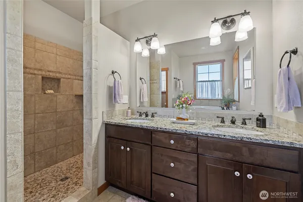 a bath tub sitting in a bathroom next to a window