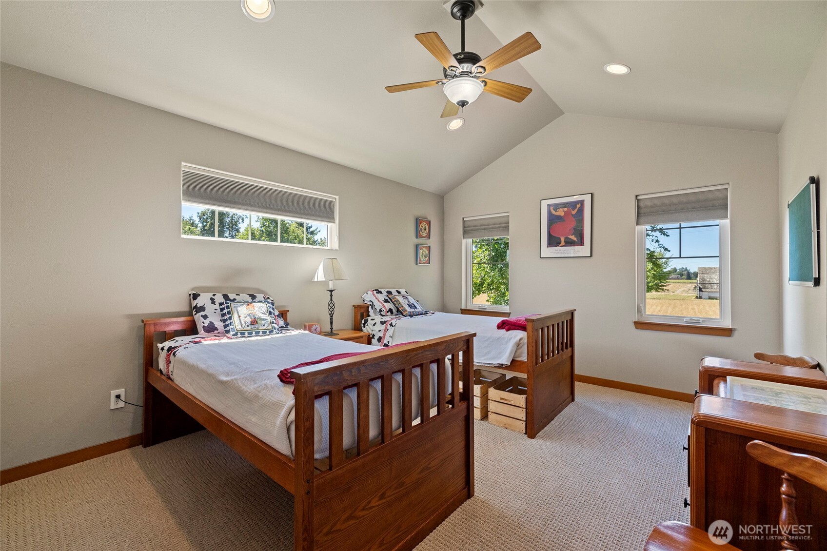 1739 Emerald Way Lynden, WA 98264 - Photo 22 of 40 a bedroom with a bed and a chandelier