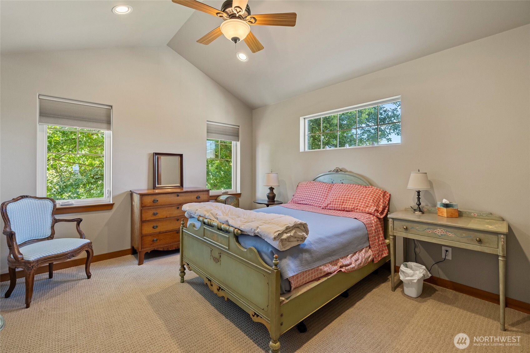 1739 Emerald Way Lynden, WA 98264 - Photo 23 of 40 a bedroom with a bed and a chandelier