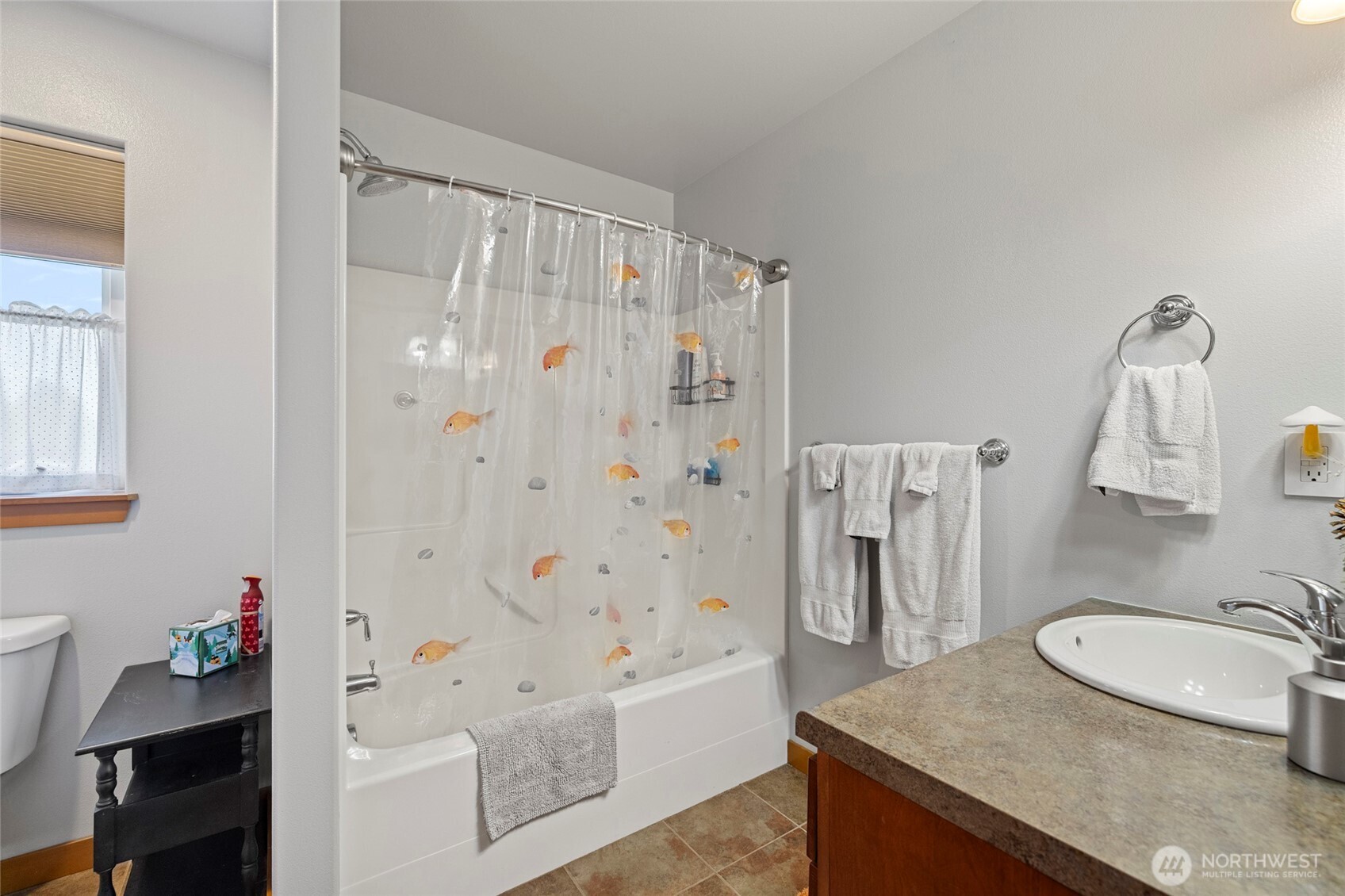1739 Emerald Way Lynden, WA 98264 - Photo 24 of 40 a bathroom with a granite countertop sink a toilet and shower