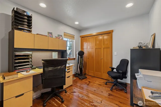 a living room with furniture and a dining table