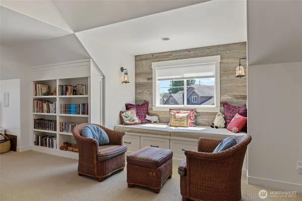 a living room with furniture a piano and a lamp