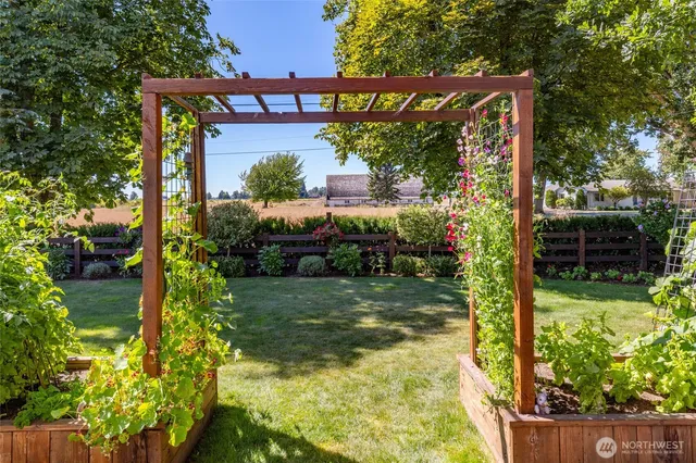 a patio with a table and chairs under an umbrella