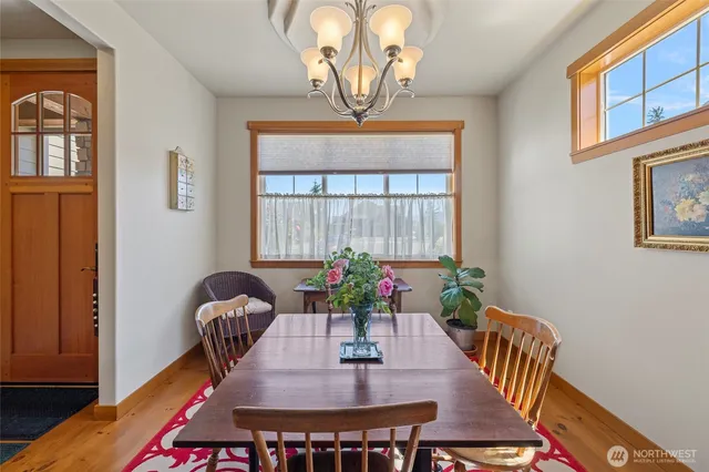 a view of a dining room with furniture window and wooden floor