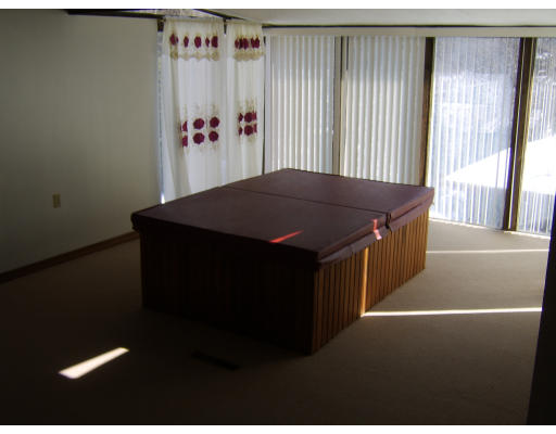 143 Royal Street Chicopee, MA 01020 - Photo 22 of 30 a bed sitting in a bedroom next to a window