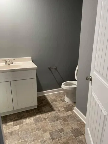a bathroom with a sink and a toilet