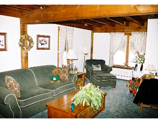 5 Upland Road Ipswich, MA 01938 - Photo 5 of 10 a living room with furniture and a large window