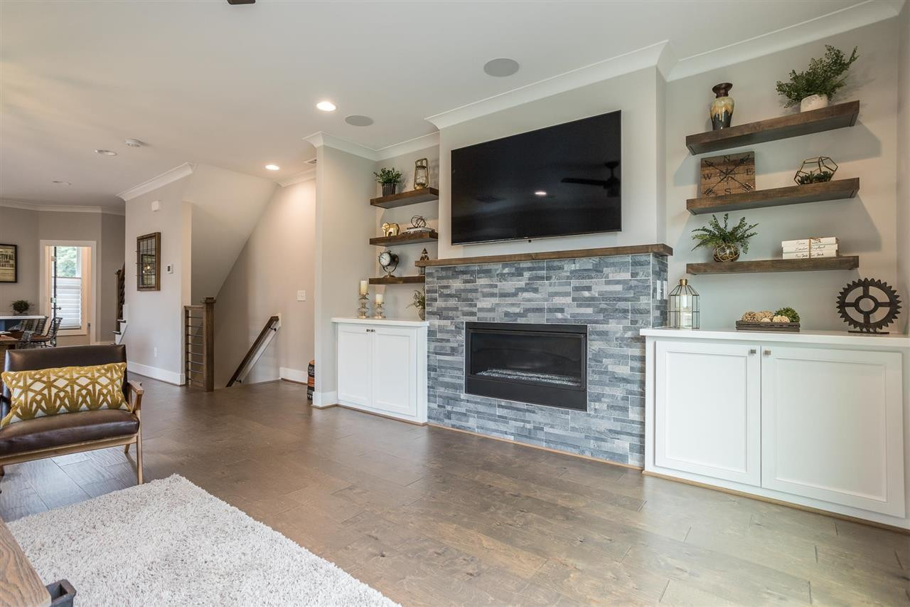 660 Watauga Street Raleigh, NC 27604 - Photo 8 of 29 Gorgeous Fireplace and Custom Bookshelves