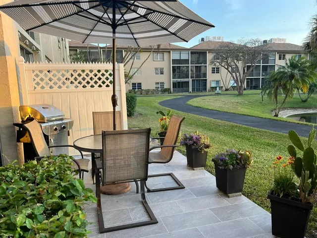 a view of a patio with chair and table