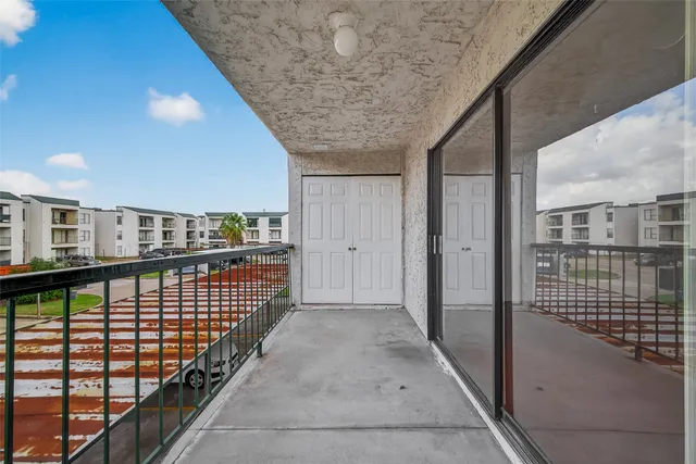 a view of balcony with wooden floor