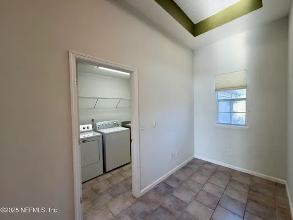 a view of a kitchen with storage and utility