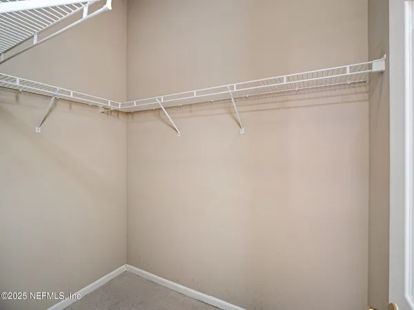 a view of a room with racks on the wall