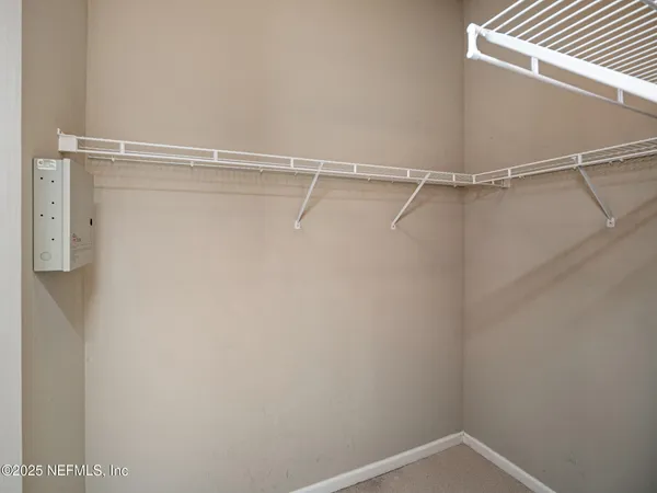 a view of a room with racks on the wall