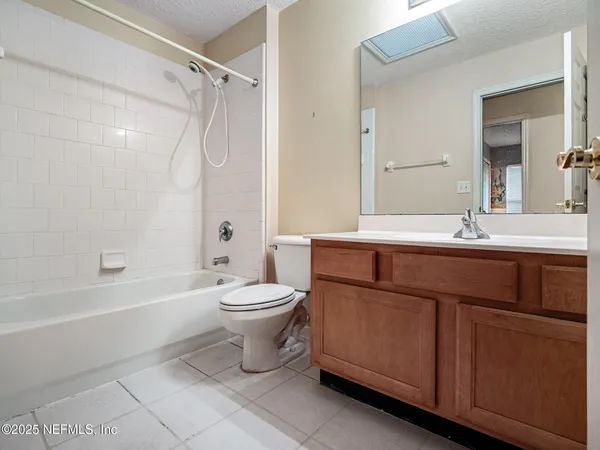 a bathroom with a sink a toilet and a bathtub