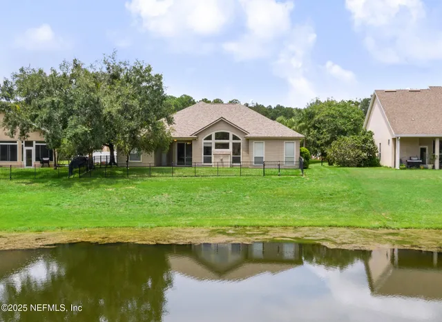 a house with swimming pool in front of it