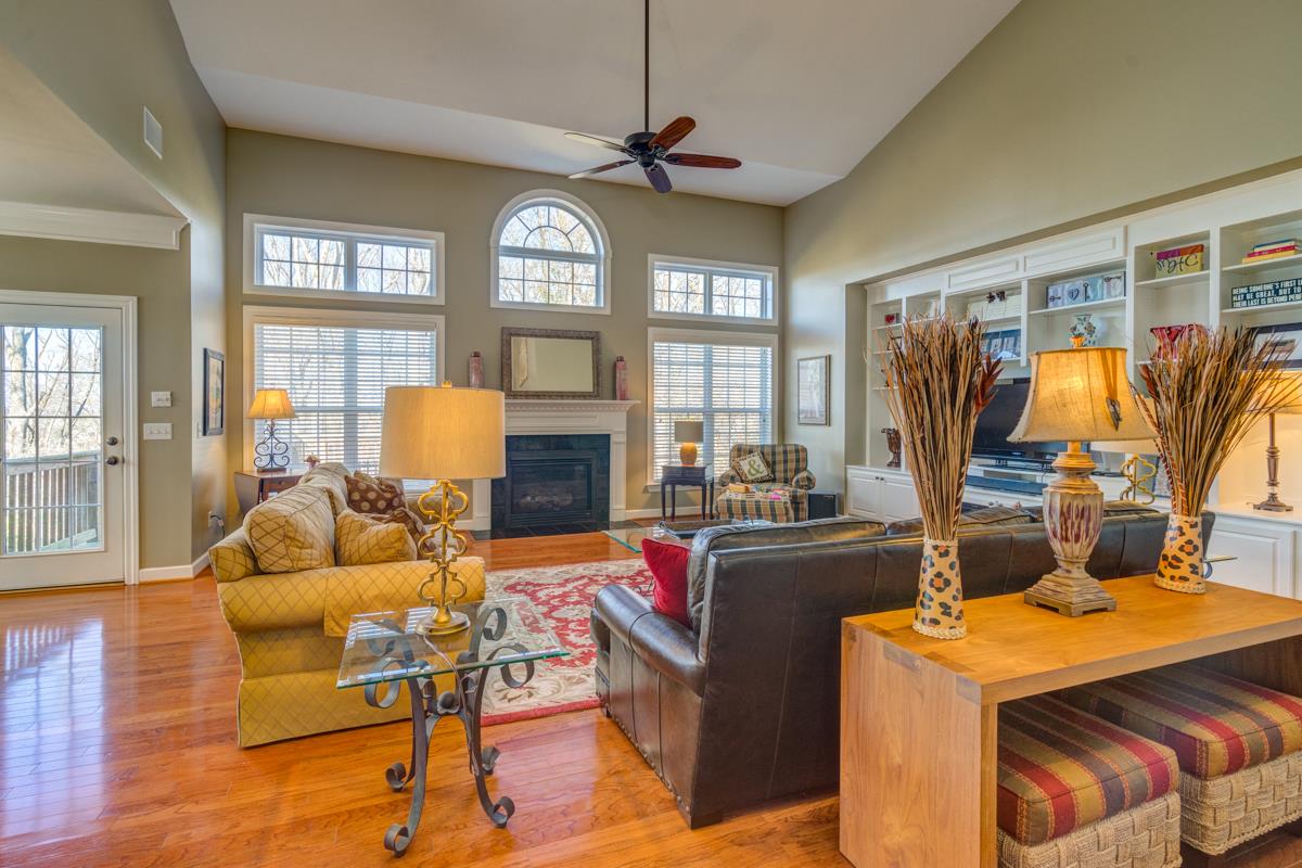 3537 Trimble Road Nashville, TN 37215 - Photo 1 of 29 a living room with furniture a flat screen tv and a floor to ceiling window