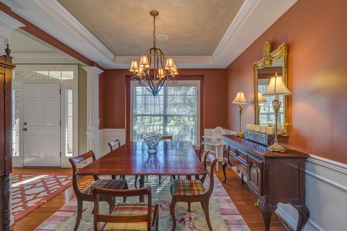 3537 Trimble Road Nashville, TN 37215 - Photo 12 of 29 a view of a dining room with furniture wooden floor and chandelier