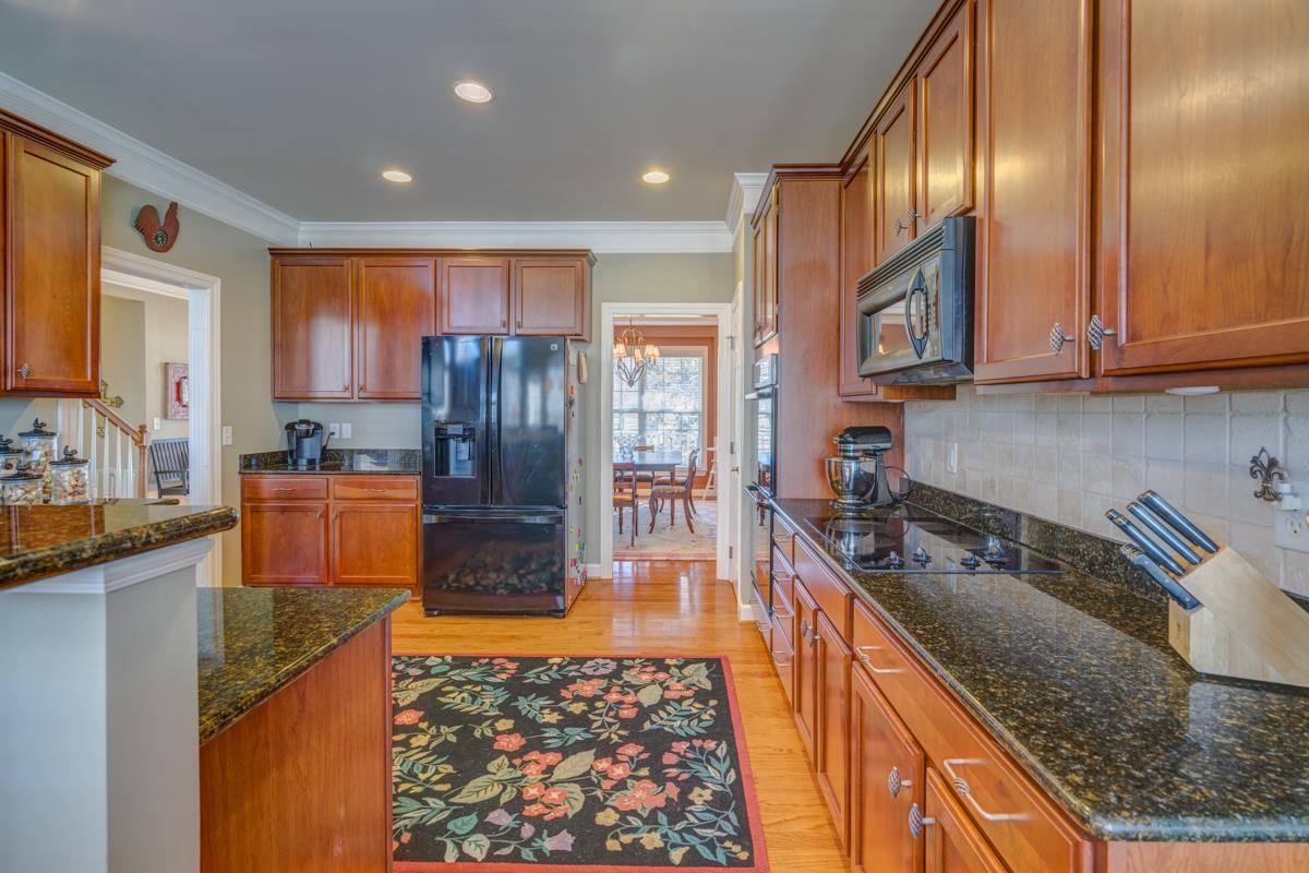 3537 Trimble Road Nashville, TN 37215 - Photo 16 of 29 a kitchen with granite countertop stainless steel appliances a sink a stove top oven a counter space and cabinets