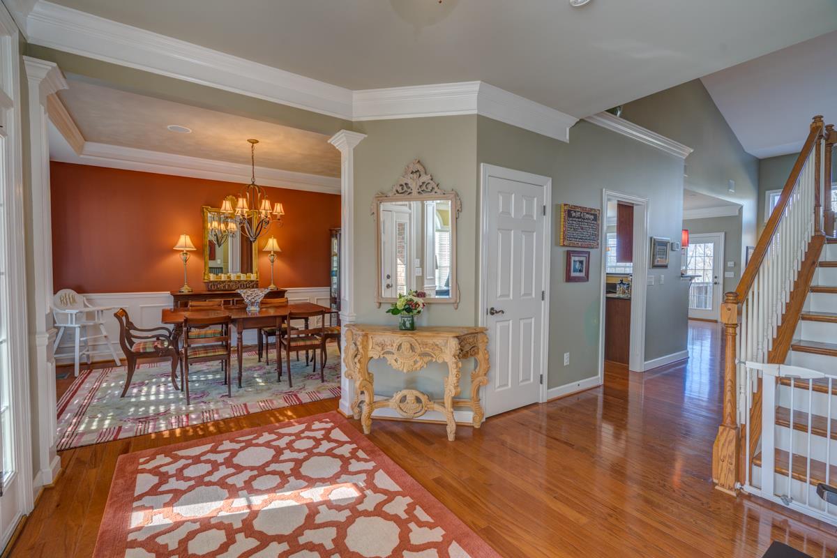 3537 Trimble Road Nashville, TN 37215 - Photo 4 of 29 a living room with furniture a dining table and large window with wooden floor